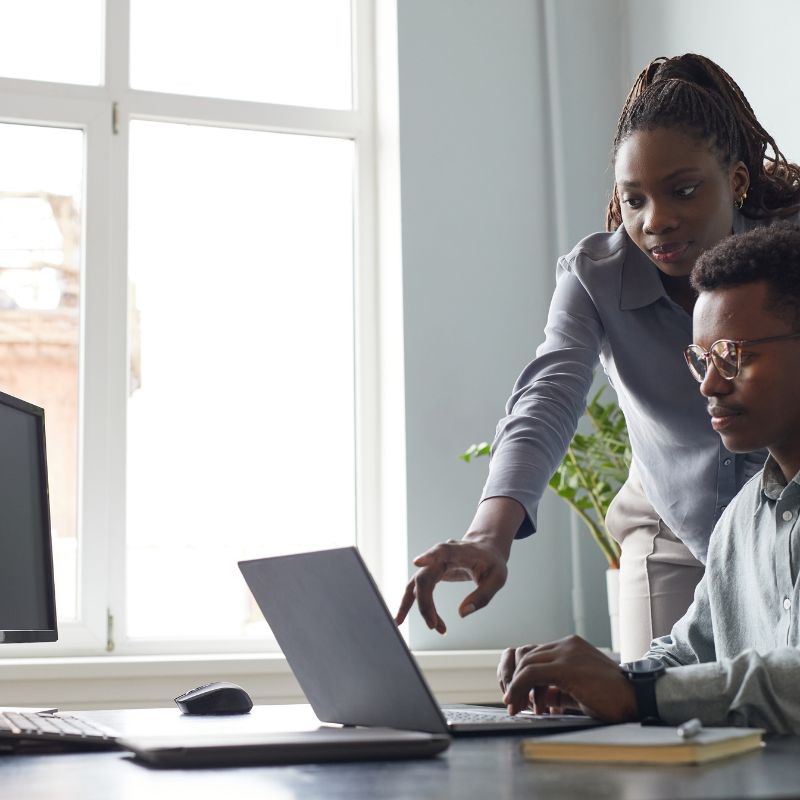 A male and female web developer at work the The Webmakers Studio Ijebu Ode.