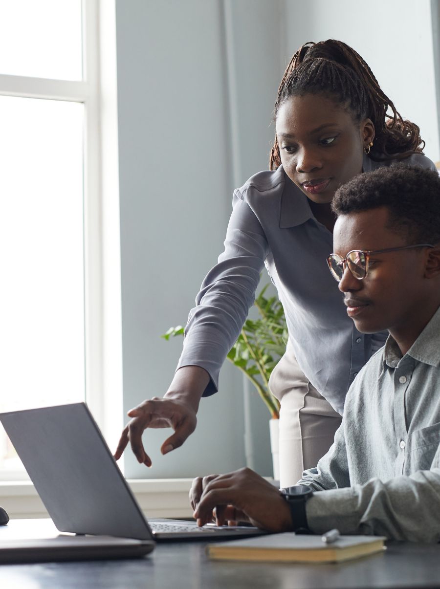 A male and female programmer at work.